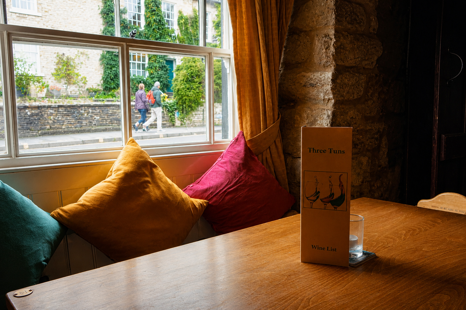 Cozy interior dining room at The Three Tuns Hay-on-Wye with log fire