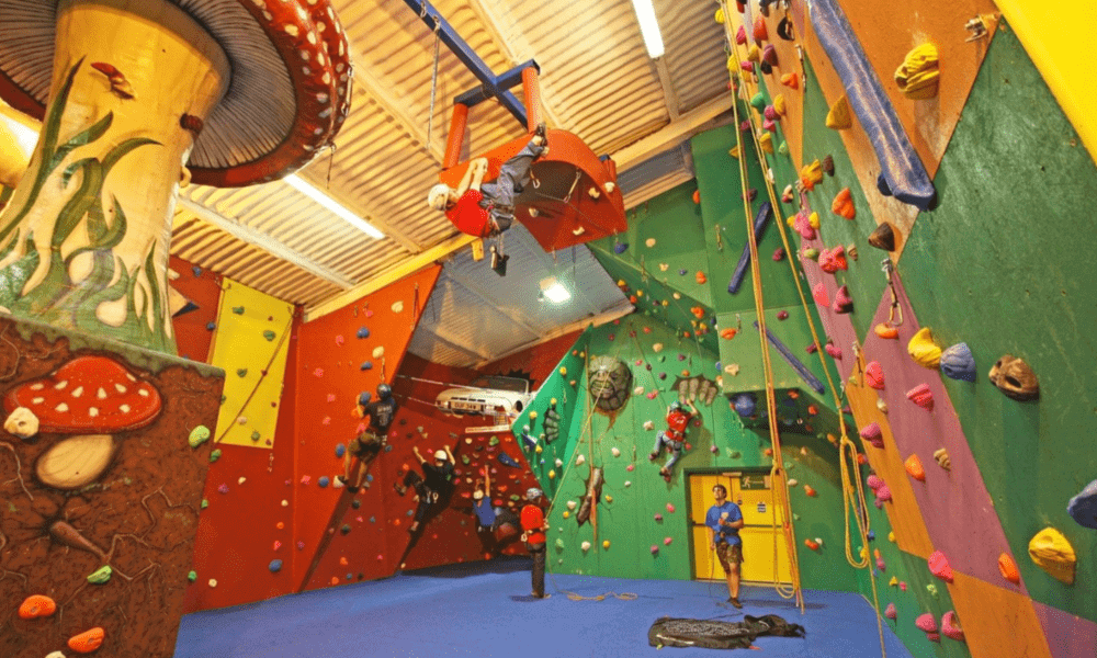 Kids enjoying indoor climbing at Llangorse Climbing Centre – fun family activity near Hay-on-Wye