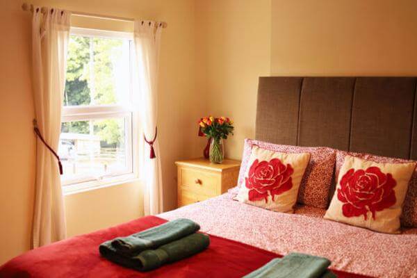 Master bedroom with countryside and horse stable views