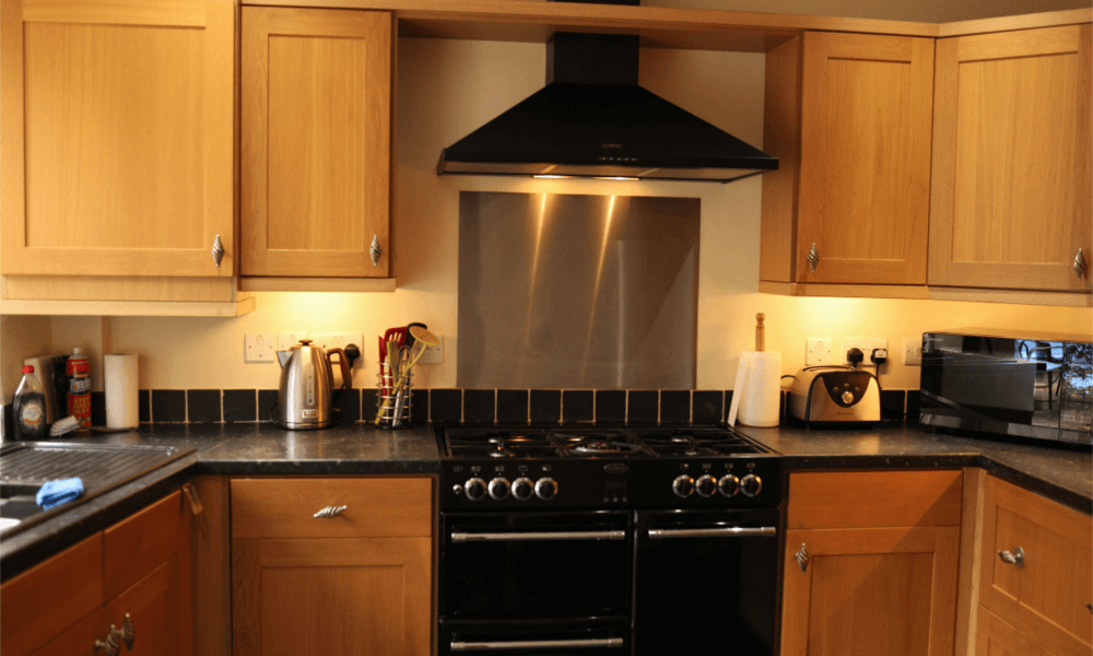 Fully equipped kitchen with modern microwave and oven at The Hay Holiday Cottage in Hay-on-Wye – ideal for self-catering stays