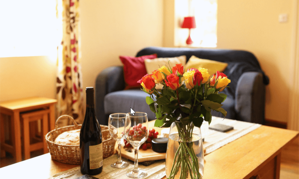 Spacious living room with a comfortable sofa at The Hay Holiday Cottage in Hay-on-Wye – perfect for relaxing after exploring the countryside