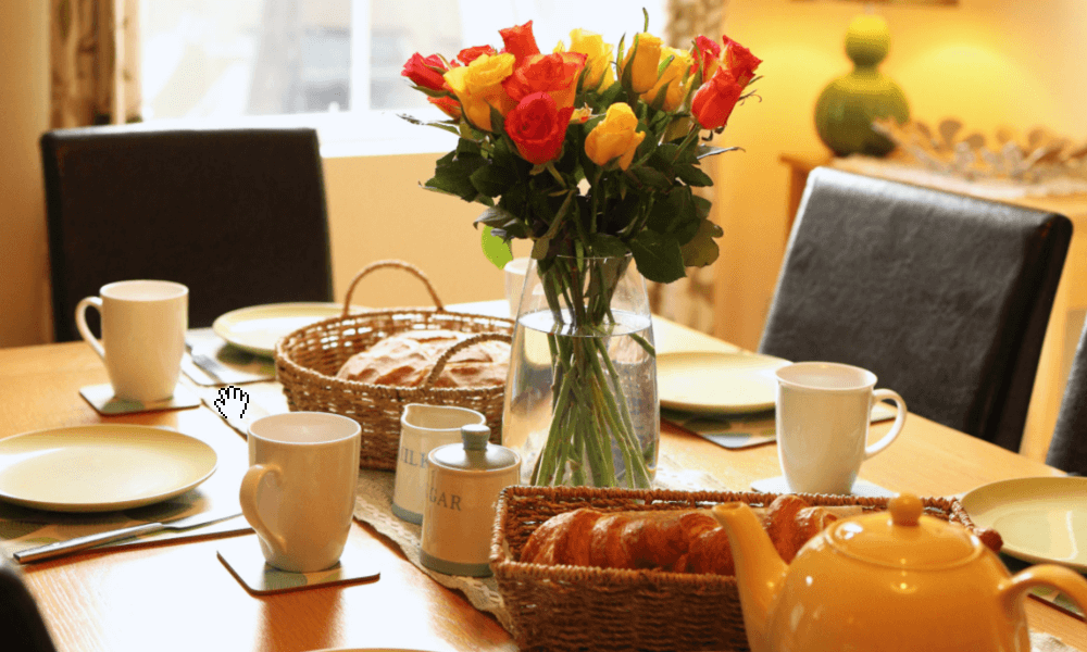 Spacious six-seat dining table at The Hay Holiday Cottage in Hay-on-Wye – ideal for family meals or group gatherings after a day exploring the Welsh countryside